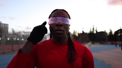 Athlete wearing futuristic smart glasses during training - Powered by Adobe