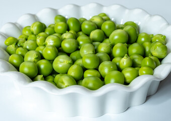 New harvest of fresh ripe green peas legumes