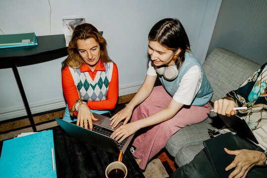 High angle view of female business professional working on laptop