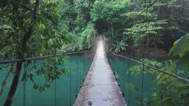 Walking across a suspension bridge in Costa Rica, Drake&rsquo;s Bay