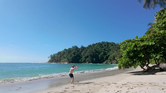 Gymnast tumbles on Costa Rica beach