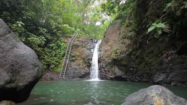 Uvita Waterfall with a natural waterslide in slow motion 
(Catarata Uvita)