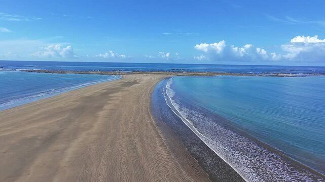 Flying shot of the Uvita Whale Tail on Costa Rica&rsquo;s Pacific coast along the shoreline