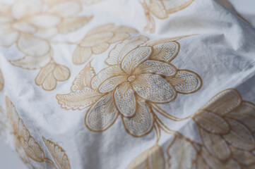 White cloth drawn with wax, one of the initial stages in making hand-drawn batik