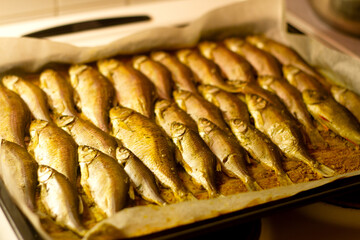 baked fish lies on a baking tray