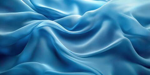 Obraz premium Elegant blue silk fabric with gentle folds creating a smooth texture shown in soft natural light during the day