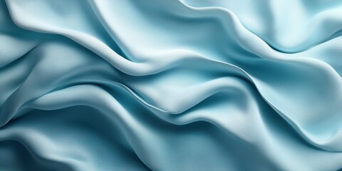 Obraz premium Elegant silk fabric with soft waves in light blue shade suitable for various design projects and fashion applications