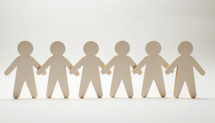 Paper cut-out figures holding hands on white background