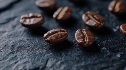 Naklejka premium Close-Up of Roasted Coffee Beans on Dark Slate Surface Highlighting Their Rich Texture and Color, Perfect for Food and Beverage Related Projects