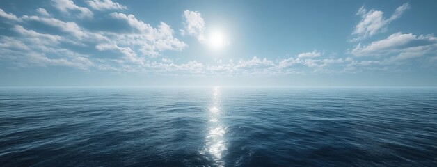 Obraz premium Tranquil Ocean View Under Blue Sky with Soft Clouds and Shimmering Sunlight Reflecting on Calm Water Surface