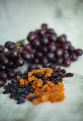 fresh grapes and raisins on the table