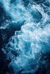 Fototapeta premium Turbulent Ocean Waves in Shades of Blue with White Foam, Capturing the Beauty and Power of Nature's Sea Movements and Textures for Nature Photography
