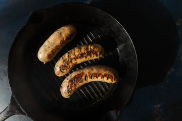 Cooking process: panfry pork sausage on a cast iron pan