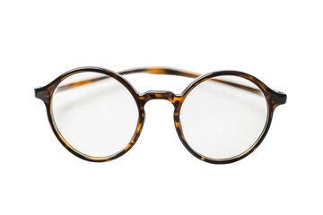 Classic round tortoiseshell glasses resting on a minimalist white background showcasing simplicity isolated on transparent background