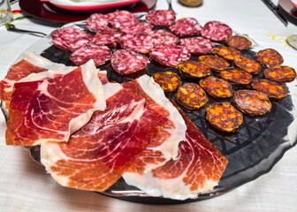 Assorted Spanish cold cuts with ham, chorizo, and salchichón on a plate