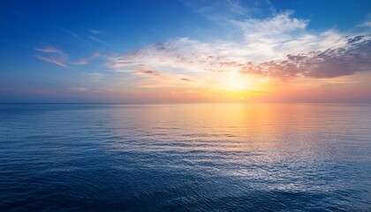 Obraz premium calm colored sea and sky at sunset