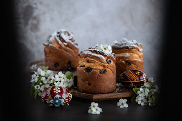 Easter cake with raisins and icing sugar on a dark background. Easter Holiday.