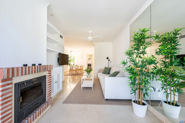 an image of a living room with furniture and a fireplace in mediterranean apartment 