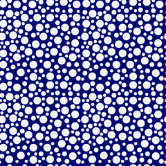 Seamless pattern of bright white polka dots on a blau background. Vector eps10
