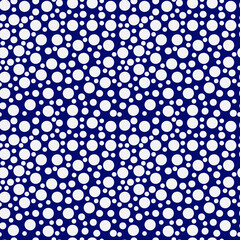 Seamless pattern of bright white polka dots on a blau background. 