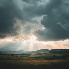 Dramatic clouds and sunrays illuminate a serene landscape in the early evening