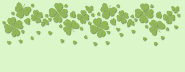 St. Patrick's Day design. Green flying clover leaves are highlighted on a green background. Vector illustration