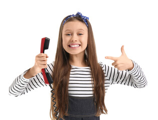 Little girl pointing at phone receiver on white background