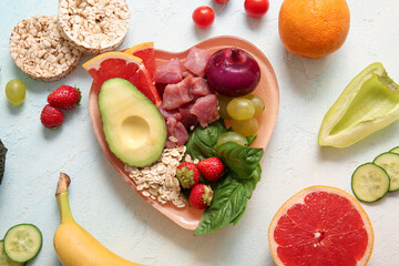 Plate with fresh healthy products on light background. Diet concept