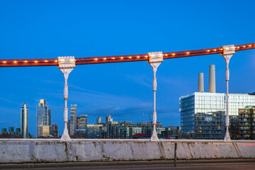 London skyline at dusk, taken from Chelsea Bridge, a bridge over the River Thames in west London.