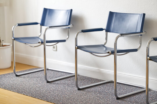 Modern Blue Chairs in Minimalist Interior in a dentist's office