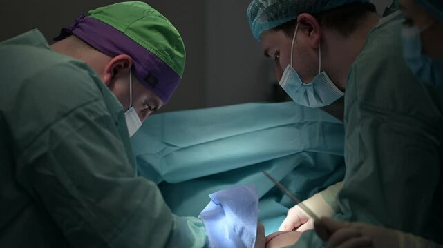 Surgeons perform vital operations in a modern operating room, ensuring patient safety. mammary mastectomy