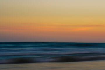 Flowing waves and soft colors blend to create a dreamy seascape.