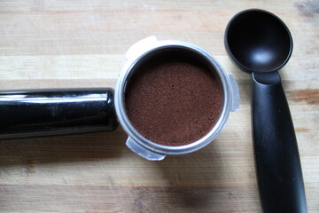 Cup of coffee pressed for the espresso machine