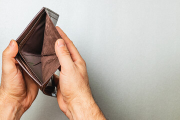 Empty wallet reflects the struggle of financial crisis and personal despair