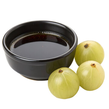 amla oil bowl with amla isolated