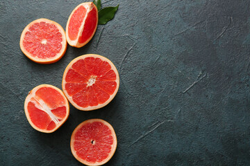 Cut fresh grapefruit on dark background