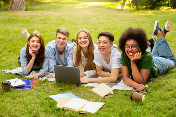 Students Life. Outdoor Portrait Of College Friends Preparing For Exam Together With Laptop And...