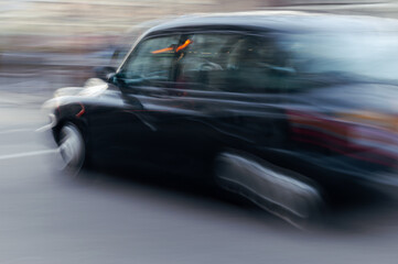 Tipycal London taxis waiting by the traffic light in front of Westminster