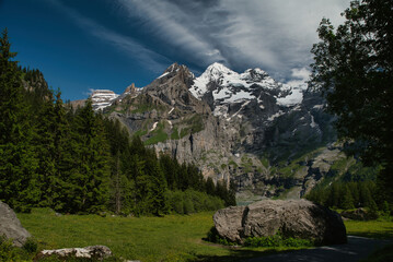 Panoramic views in the Oeschinen Valley, on a hiking trail to the Oeschinen Lake. Located in the Bernese Oberland, Switzerland. Spring season