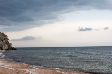 landscape clouds over the sea. Stormy gray clouds
