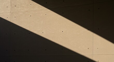 Abstract Concrete Wall Texture with Diagonal Shadow: Modern Architectural Detail in Natural Sunlight, Minimalist Background.
