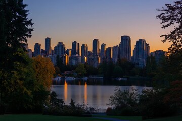 Obraz premium Stunning Cityscape Sunset Golden Hour Urban Skyline Modern Architecture Beautiful Buildings Peaceful Lake Waterfront Evening Twilight Serene Nature 