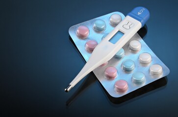 thermometer and pills