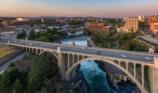 Spokane, Washington, USA. An aerial view of the Monroe Street Bridge, cars, and the Spokane River. The bridge is a vital transportation route., USA