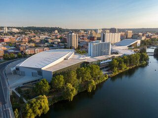 Fototapeta na wymiar Aerial view of Spokane, Washington, showcasing the Spokane Convention Center and the DoubleTree hotel along the Spokane River. A vibrant cityscape. USA