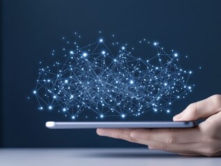 Hand holding a tablet displaying a glowing network of interconnected nodes and lines