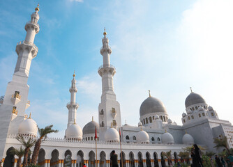 Obraz premium Grand Mosque White Domes Under Azure Sky In City Of Surakarta, Indonesia. Cultural Landmarks &