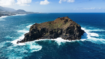 Aerial view of the Rock of Garachico, a small islet protected as a nature reserve located off the coast of Garachico, a village on the northern coast of Tenerife in the Canary Islands, Spain