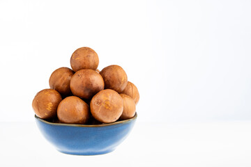 Organic macadamia nuts in bowl - Macadamia integrifolia.