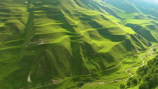 Scenic aerial shot of Maltas Canyon, Dagestan, showcasing lush mountains, alpine forests, sunlight, and a river cutting through the canyon with drifting clouds.